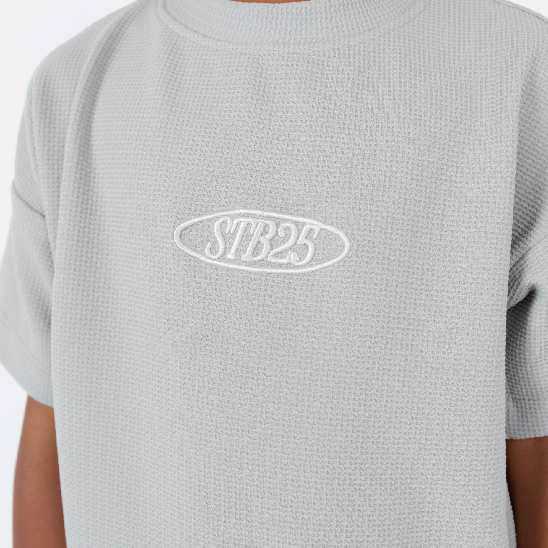 Oversize niño textura gris