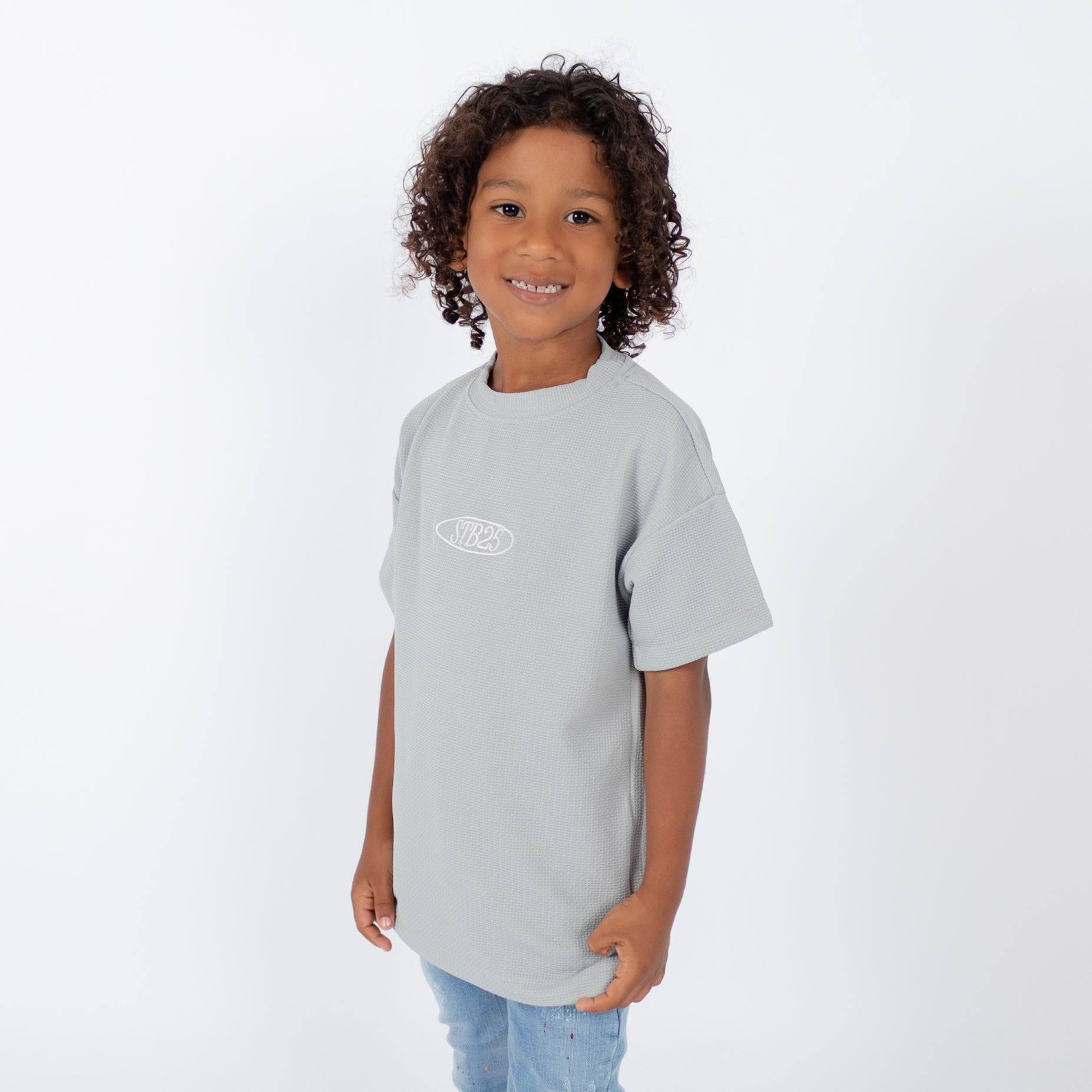 Oversize niño textura gris