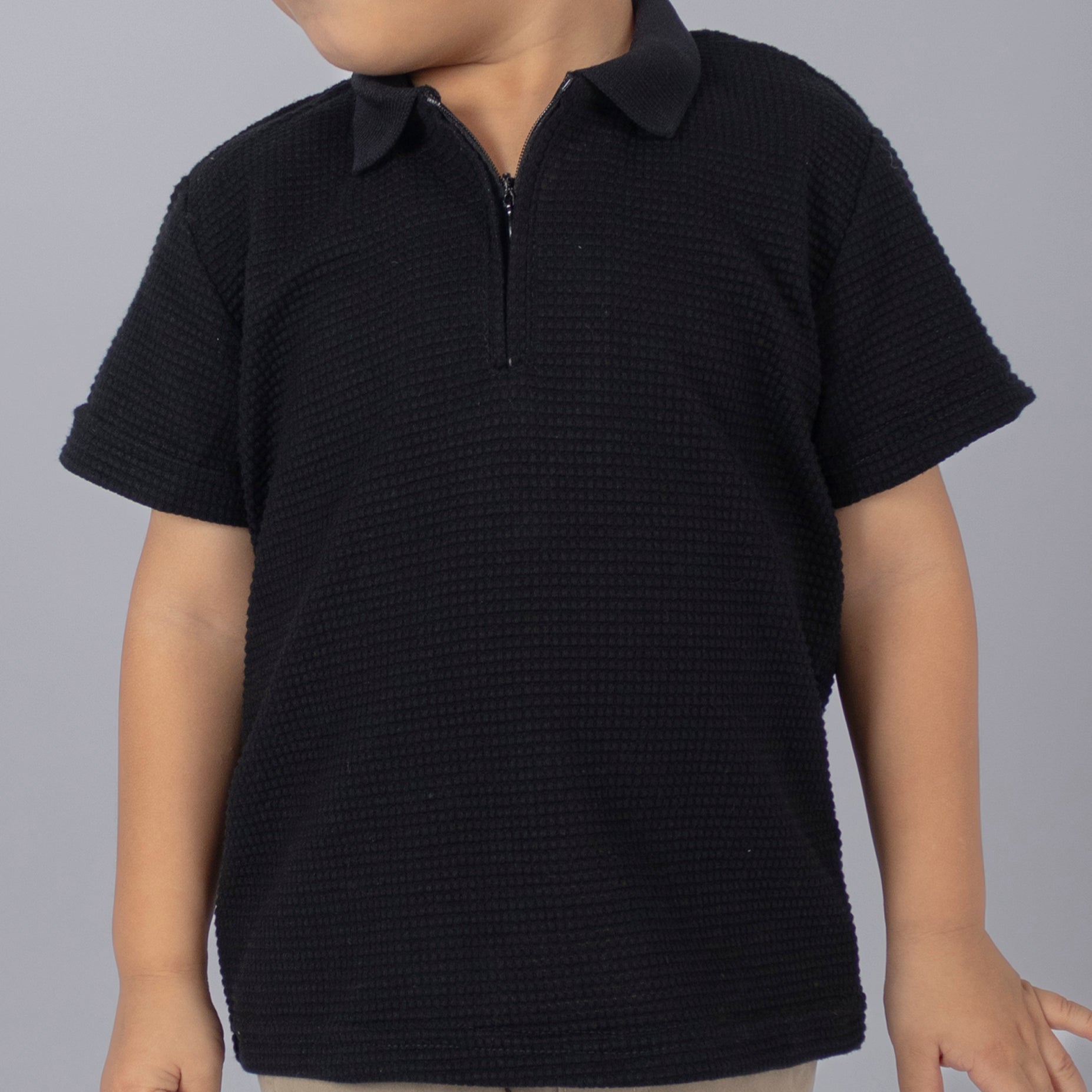 Polo baby cierre textura negro