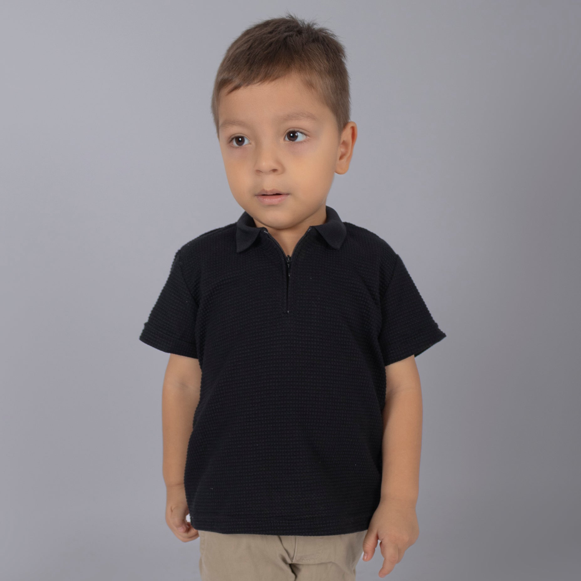 Polo baby cierre textura negro
