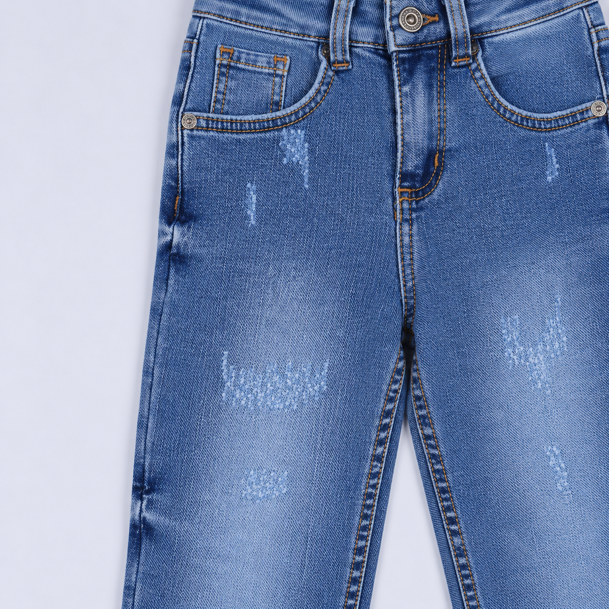 Jean niño skinny claro con rasguños