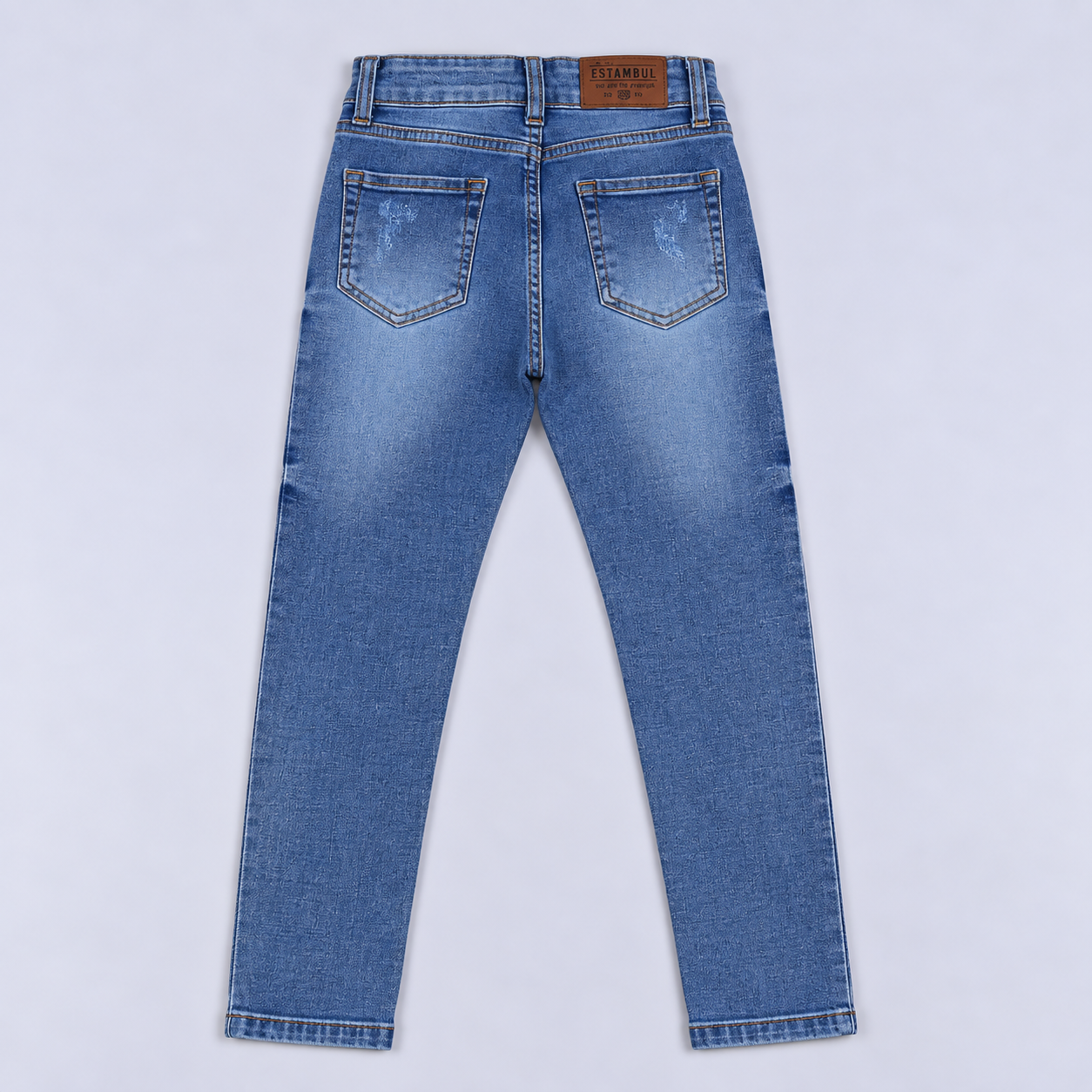 Jean niño skinny claro con rasguños