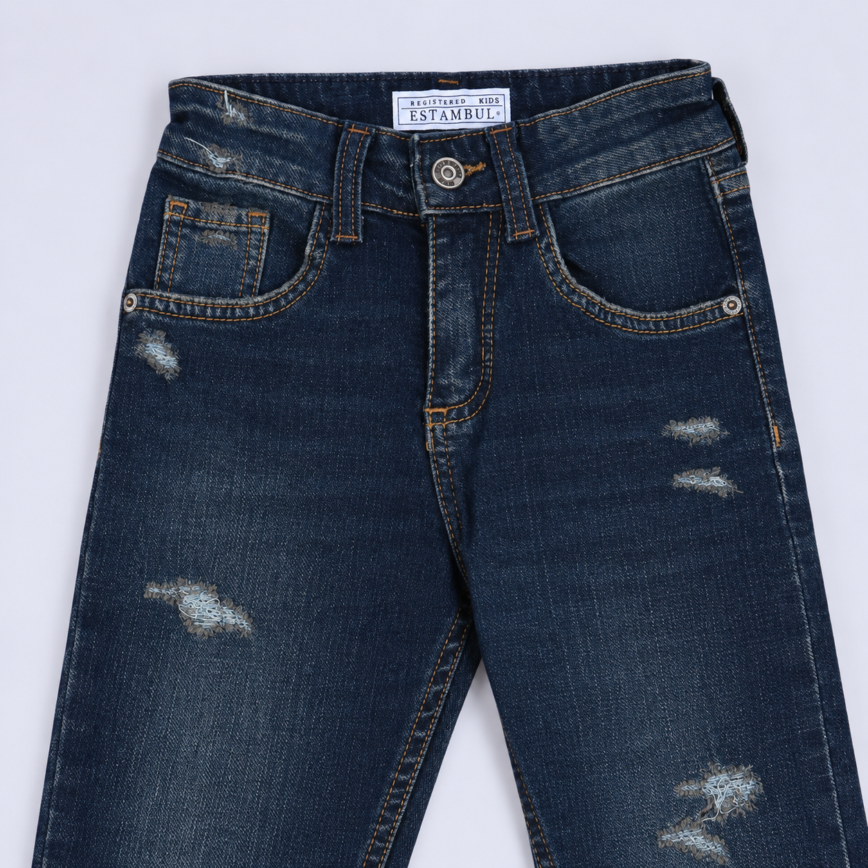Jean niño skinny oscuro con desgaste