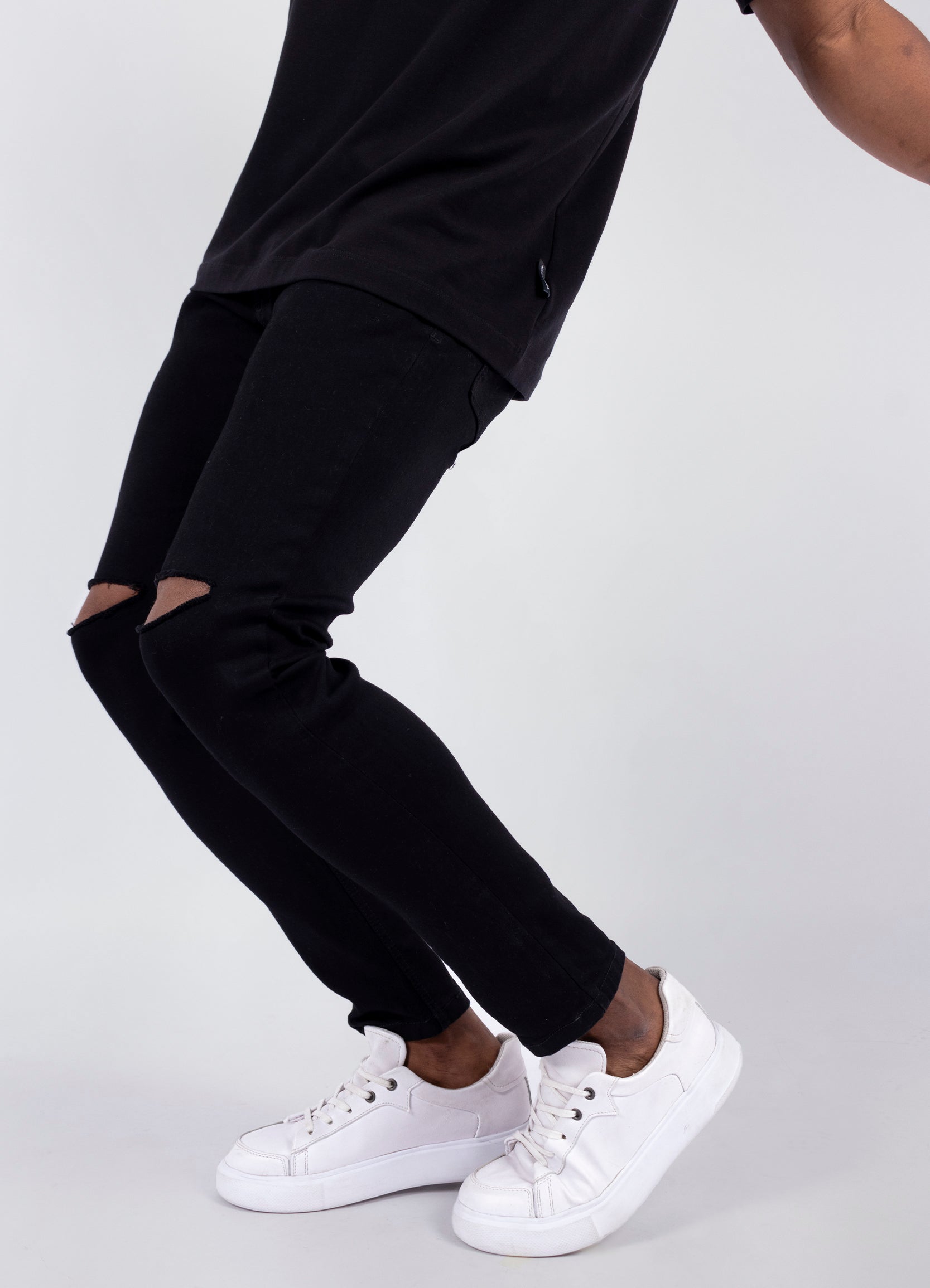 Jean hombre Skinny negro roto rodilla