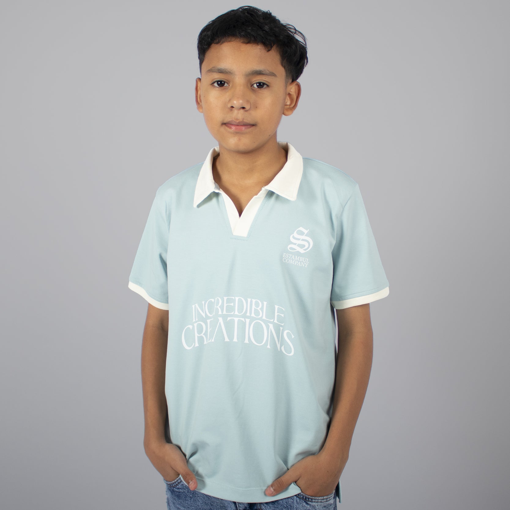 Polo niño cuello verde agua