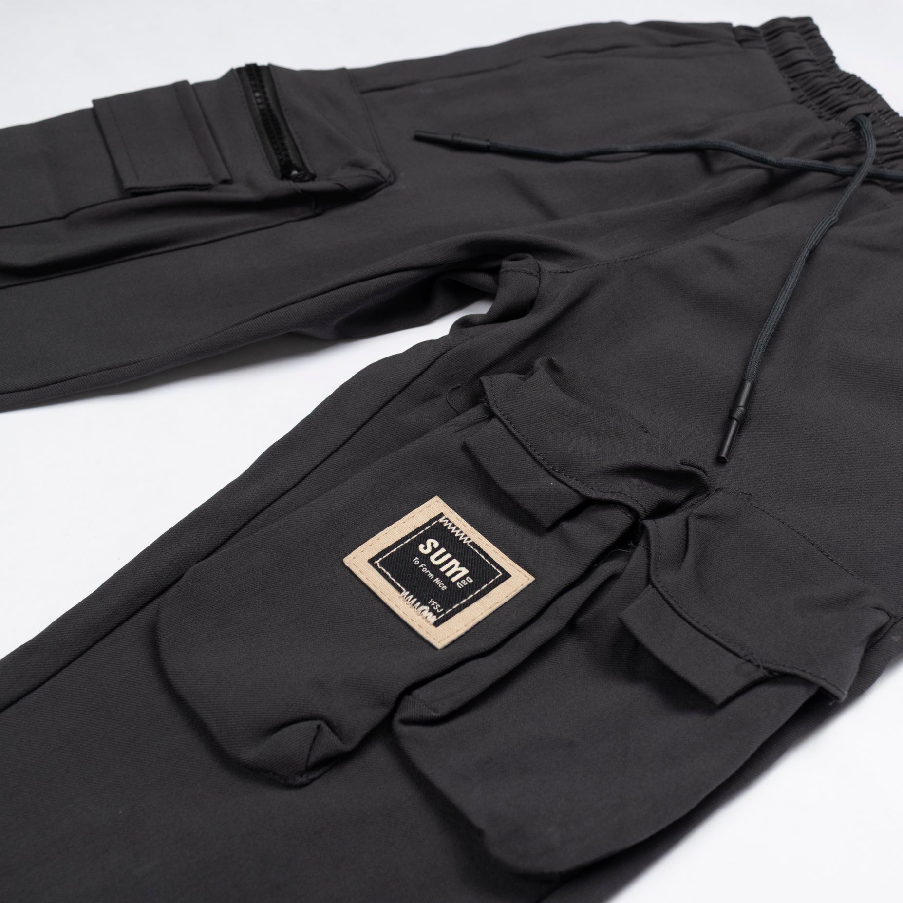 Jogger niño bolsillos gris